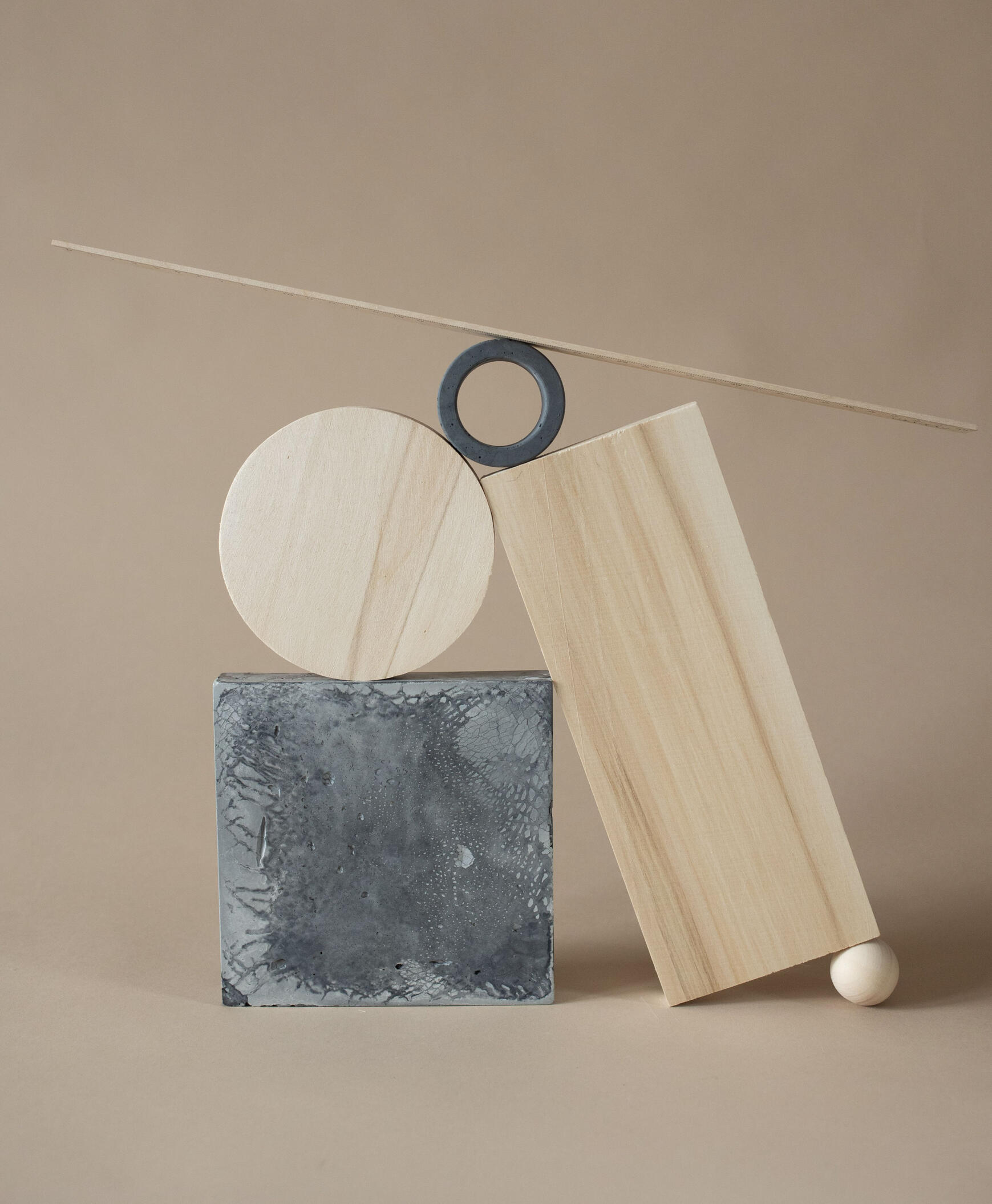 Shapes balancing on one another